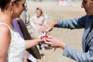 a celebrant tying ribbon 